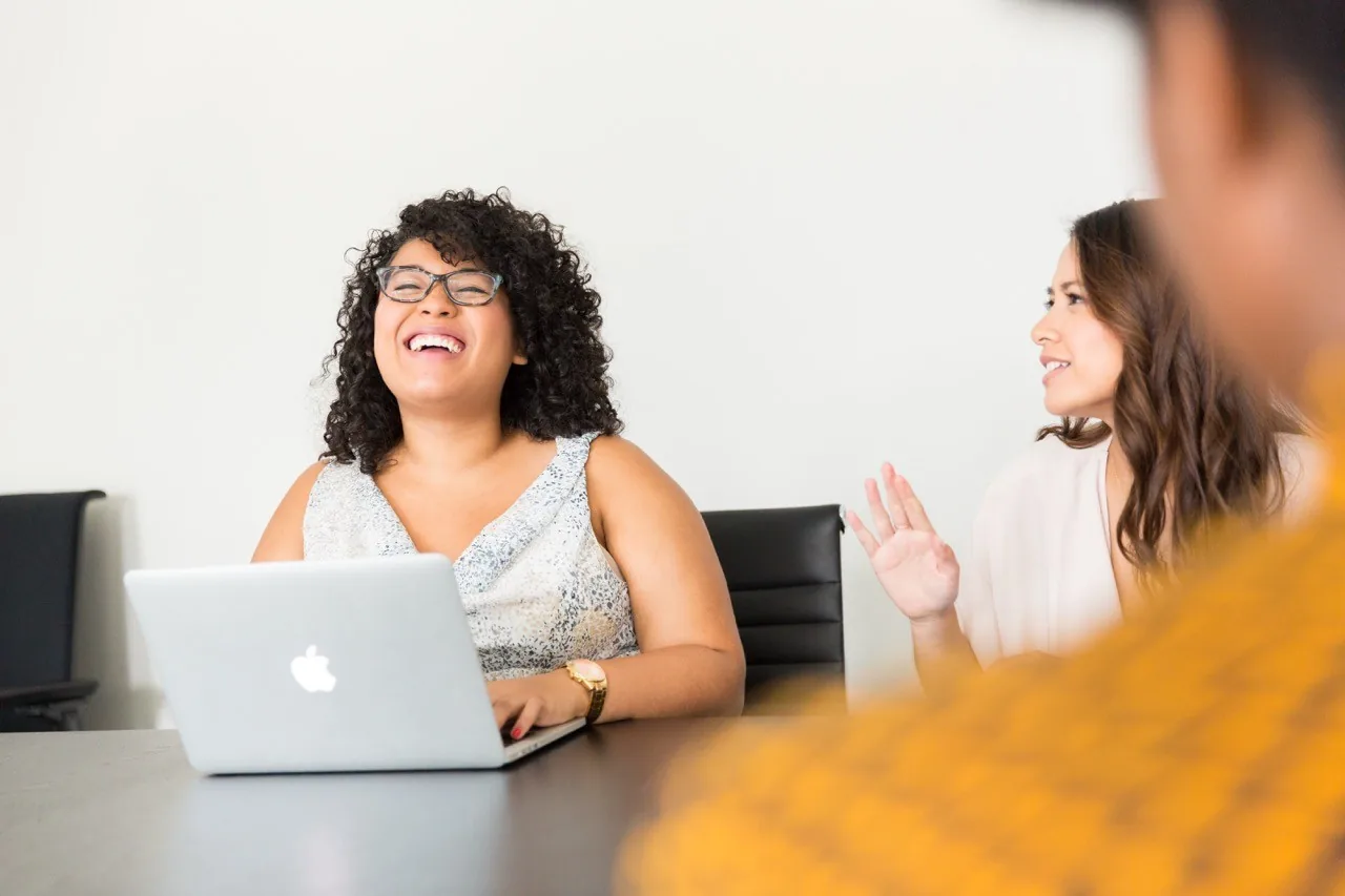 woman smiling with laptop